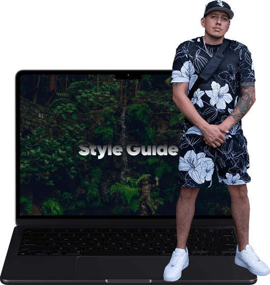 an open apple laptop with green flowers on the screen with a person super imposed standing on the laptop keyboard 